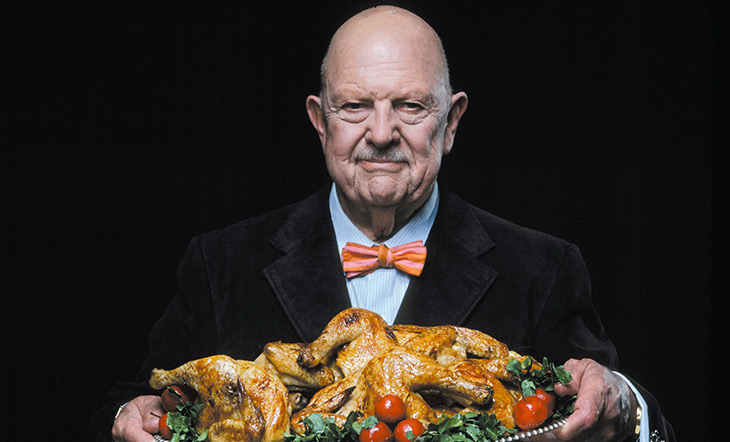 James Beard holding a tray of cooked chicken Photo by Dan Wynn