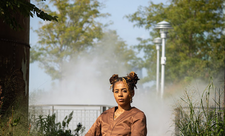 Image of chef Lay Alston wearing a brown shirt outrdoors