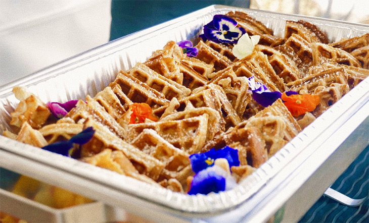 Food photo from Plate of Hue. Food shot of waffles and edible flowers in a chafing dish 