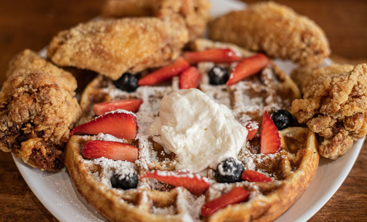 Chicken and Waffles with fresh fruit and whipped cream from Yo' Mama's Restaurant in Birmingham, Alabama photo by Tan Crowder Photography